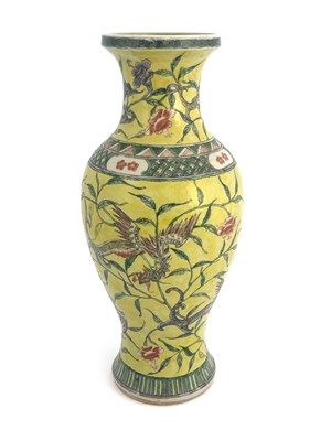 Lot 577 - A Chinese famille jaune vase, inverse baluster...