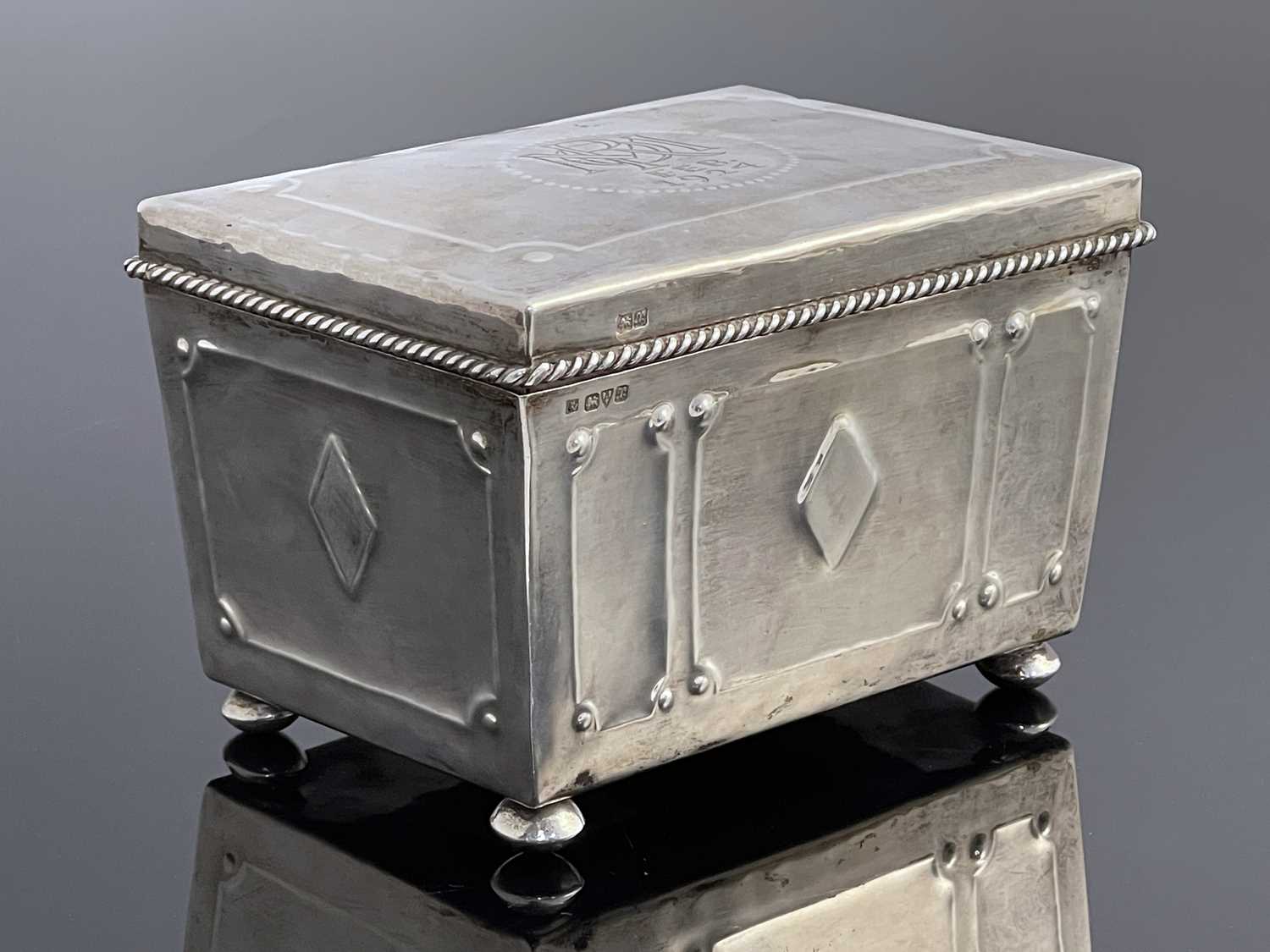 Lot 122 - Hugh Wallis, an Arts and Crafts silver casket,...