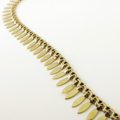 Lot 168 - A yellow gold fringe necklace, with French...