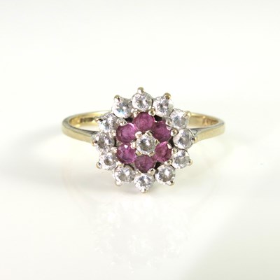 Lot 162 - A 9ct gold diamond and ruby cluster ring, ring...