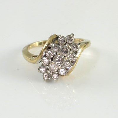 Lot 187 - a 14kt gold diamond cluster ring