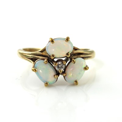 Lot 171 - A gold, three stone opal and diamond ring,...