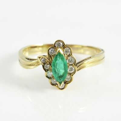 Lot 181 - An 18ct emerald and diamond cluster ring,...