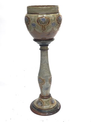 Lot 797 - A Royal Doulton stoneware jardiniere and stand,...