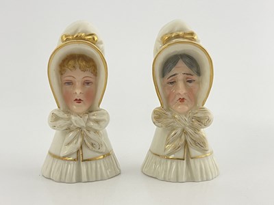 Lot 938 - Two Royal Worcester candles snuffers, the Old...