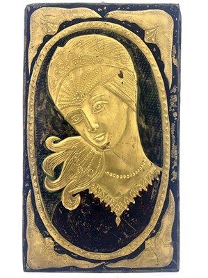 Lot 513 - A repousse embossed panel of a woman's head,...