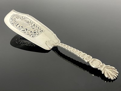 Lot 220 - A George IV silver fish slice, perhaps a...