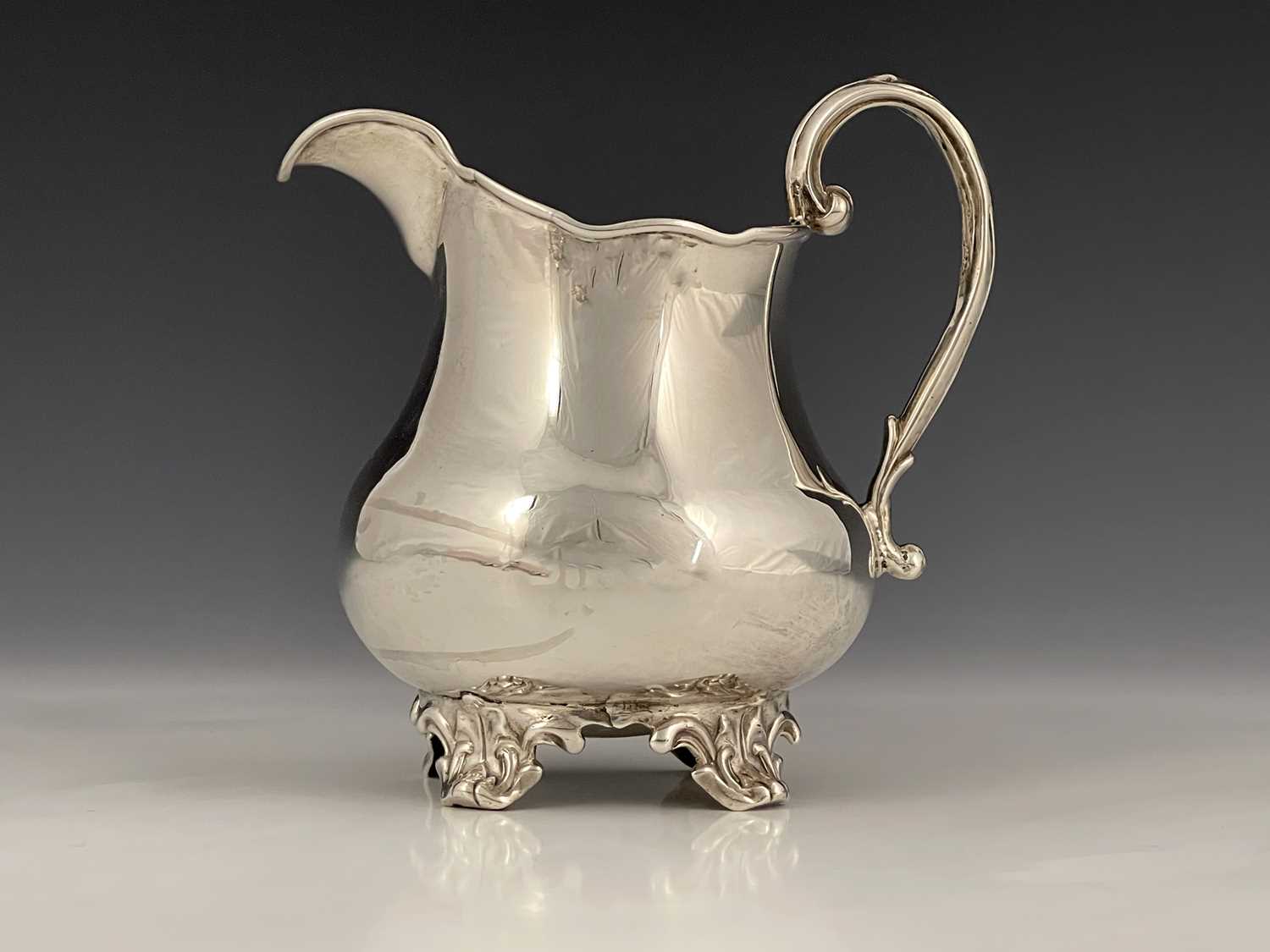 Lot 10 - A Victorian silver milk or cream jug, of squat...