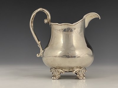Lot 10 - A Victorian silver milk or cream jug, of squat...