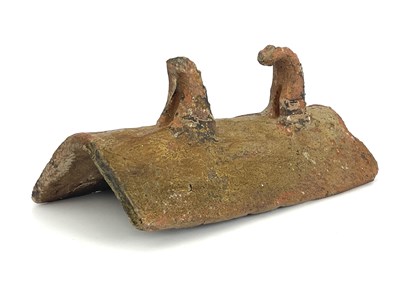 Lot 1022a - A Medieval pottery ridge tile, with two thorn...