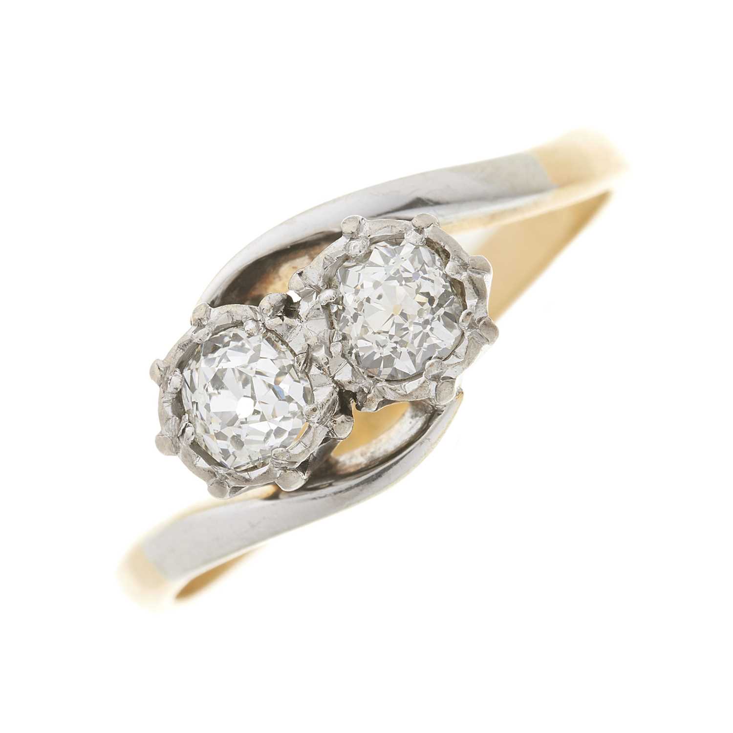 Lot 15 - An 18ct gold old-cut diamond two-stone crossover ring