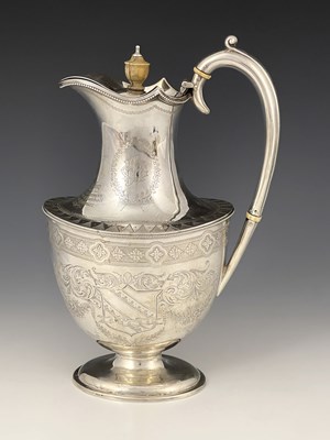 Lot 204 - A late Victorian silver hot water jug, with...