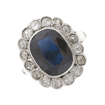 Lot 155 - A mid 20th century sapphire and diamond cluster dress ring