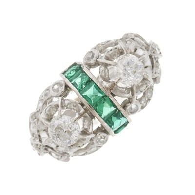 Lot 161 - A mid 20th century diamond and emerald dress ring