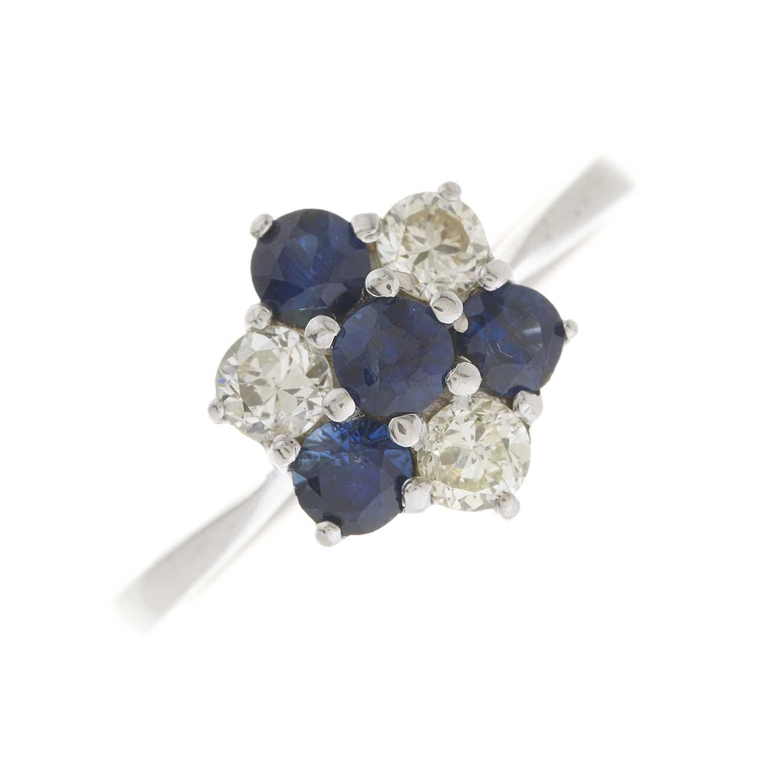 Lot 50 - A mid 20th century sapphire and diamond cluster ring