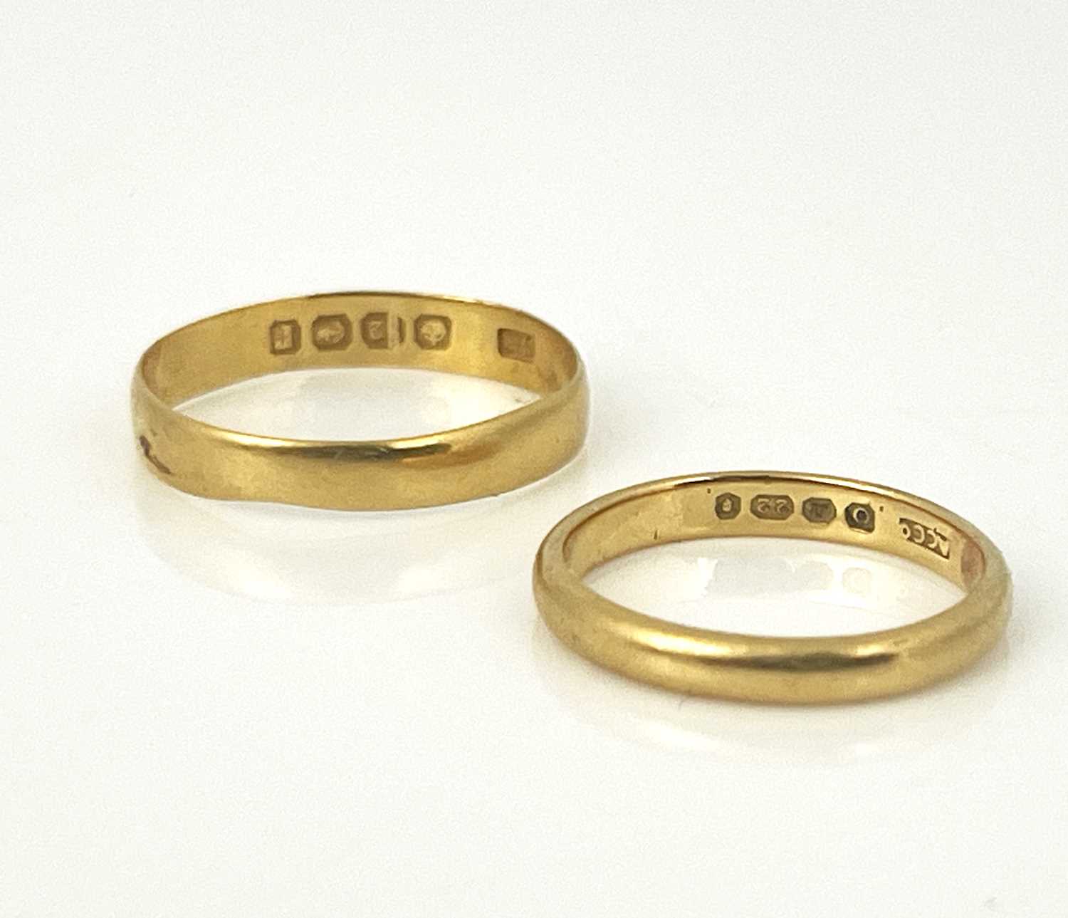 Lot 5 - Two 22 carat gold wedding bands, size M and...