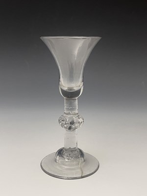 Lot 555 - A balustroid wine glass, circa 1730, the bell...