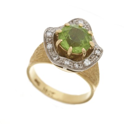 Lot 137 - A 1970s 18ct gold peridot and diamond dress ring
