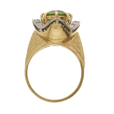 Lot 137 - A 1970s 18ct gold peridot and diamond dress ring