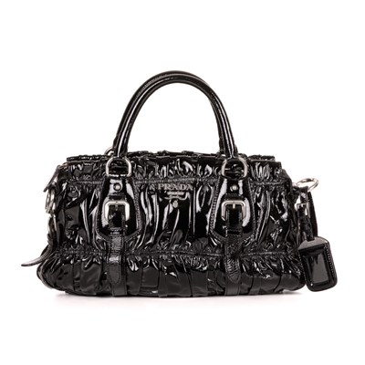 Lot 447 - Prada, a black patent leather Gaufre handbag,...