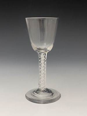 Lot 559 - An opaque twist wine glass, circa 1755, the...