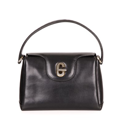 Lot 365 - Gucci, a vintage G Turn-Lock handbag, crafted...