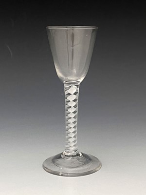 Lot 561 - An opaque twist wine glass, circa 1755, the...