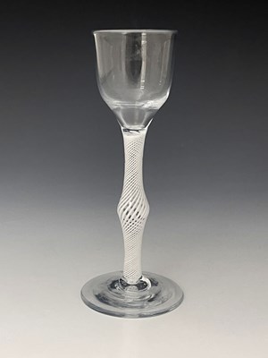 Lot 562 - An opaque twist wine glass, circa 1760, the...