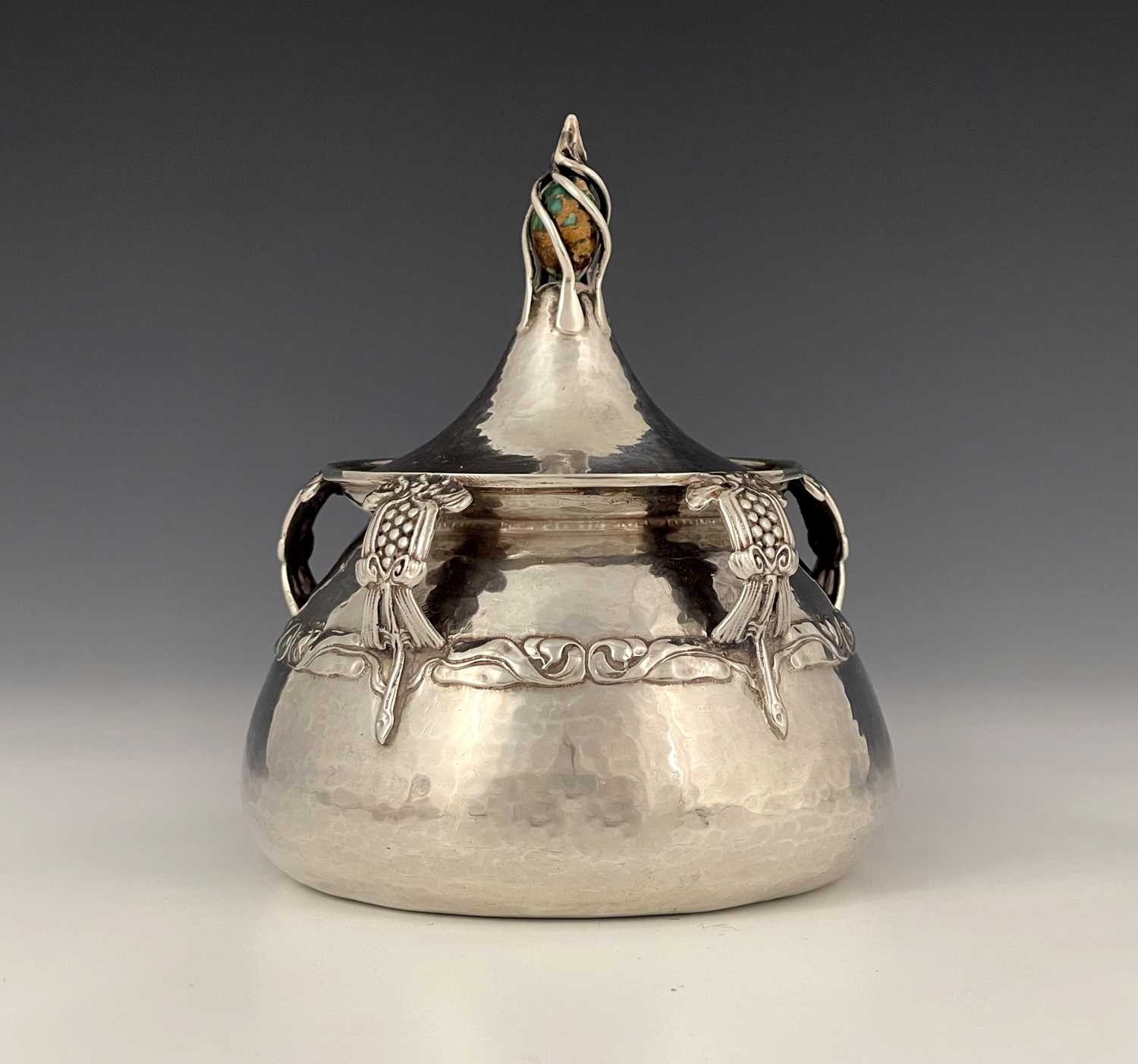 Lot 27 - An Edwardian Arts and Crafts silver inkwell,...