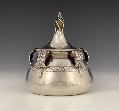 Lot 27 - An Edwardian Arts and Crafts silver inkwell,...