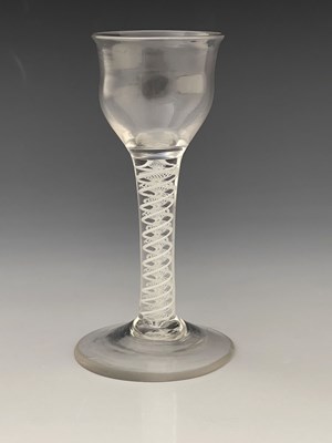 Lot 564 - An opaque twist wine glass, circa 1760, the...