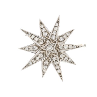 Lot 115 - A large silver and gold diamond star brooch