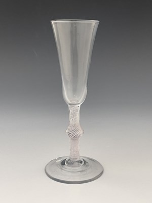 Lot 565 - An opaque twist glass flute, circa 1760, the...