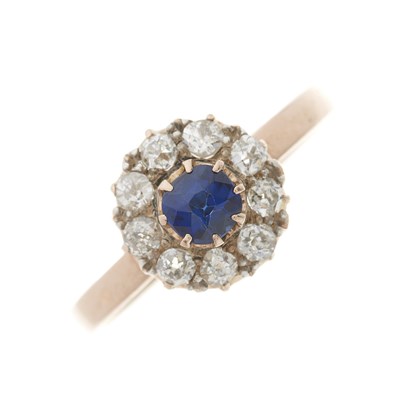 Lot 120 - A gold sapphire and diamond cluster ring