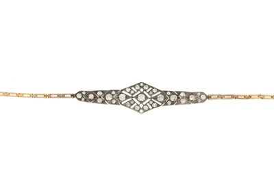 Lot 111 - An early 20th century gold and silver diamond openwork bracelet