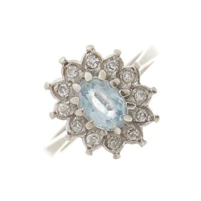 Lot 173 - An 18ct gold aquamarine and diamond cluster ring