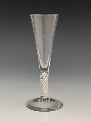 Lot 569 - An opaque twist glass flute, the optic fluted...