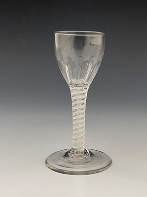 Lot 570 - An opaque twist wine glass, circa 1765, the...