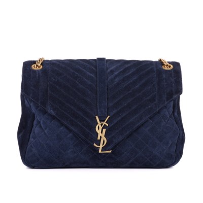 Lot 472 - Yves Saint Laurent, a blue suede Matelasse...