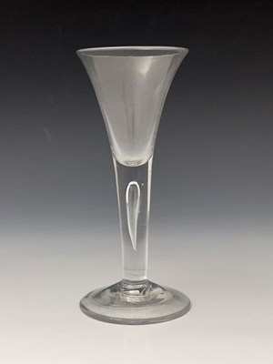 Lot 571 - A tear drop wine glass, circa 1760, the...