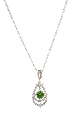 Lot 164 - An 18ct gold green tsavorite garnet and diamond pendant