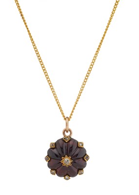 Lot 114 - A late Victorian gold garnet and diamond cluster pendant