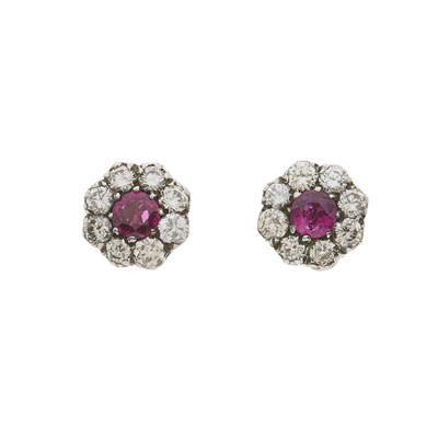 Lot 125 - A pair of silver and gold, ruby and diamond floral cluster stud earrings