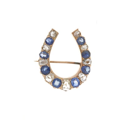 Lot 119 - A late Victorian gold, diamond and sapphire horseshoe brooch