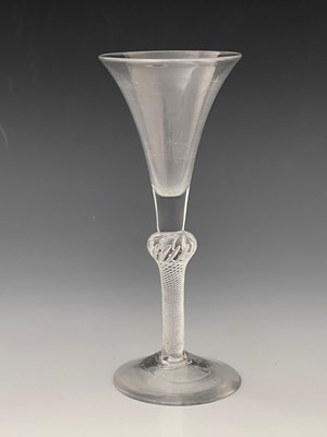 Lot 575 - A composite stem wine glass, circa 1750, the...