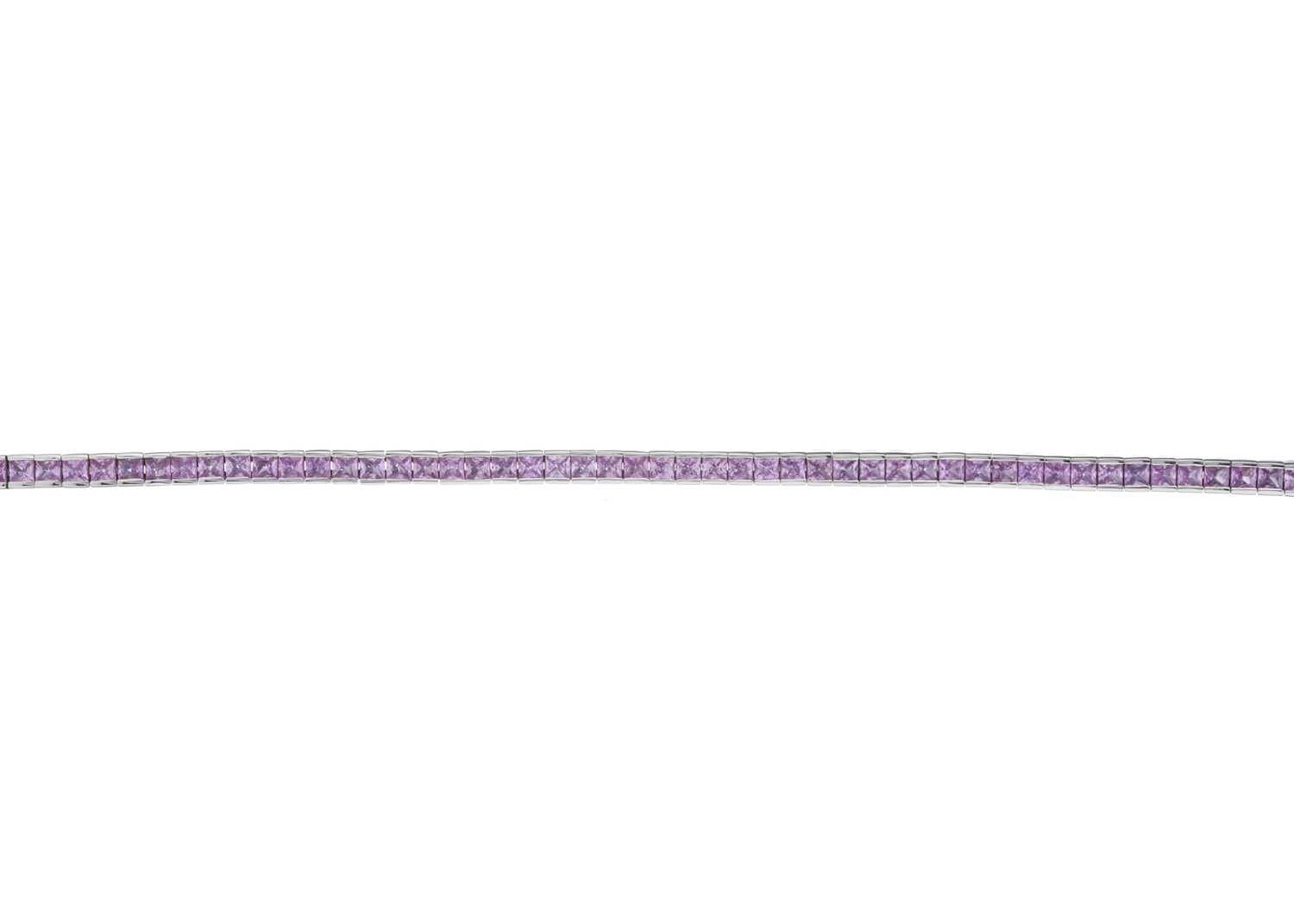 Lot 30 - An 18ct gold pink sapphire line bracelet
