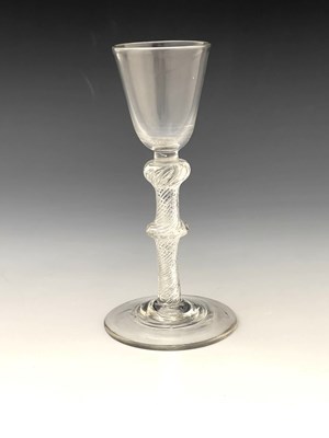 Lot 577 - A composite stem wine glass, circa 1755, the...