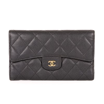 Lot 308 - Chanel, a quilted wallet, featuring a diamond...