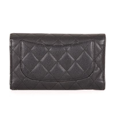 Lot 308 - Chanel, a quilted wallet, featuring a diamond...