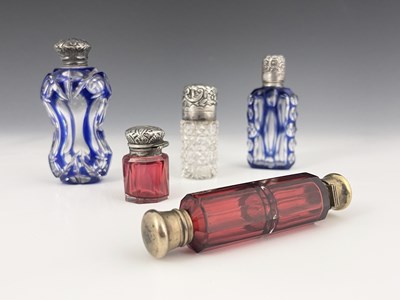 Lot 154 - A group of five coloured cut glass scent...